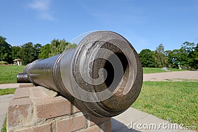 Barrel of an old-fashioned cast-iron cannon Stock Photo