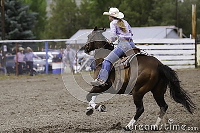 Barrel Racer Flying Across The Arena Editorial Stock Photo
