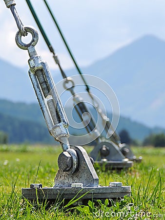 A barrel strainer anchored in grass. Stock Photo