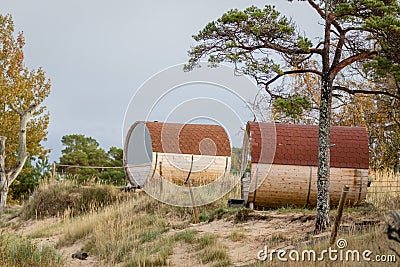 Barrel sun houses on the sand dunes in Kolka, Latvia beach Stock Photo