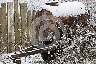 Barrel on wheels in the snow Stock Photo