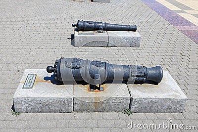 The barrels of old guns on the city embankment. Russia, Krasnodar Territory, Novorossiysk, July 22, 2019 Editorial Stock Photo