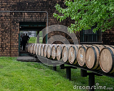 Barrels Roll Through Building Editorial Stock Photo