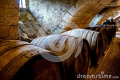 Barrels in a rustic wine cellar Stock Photo