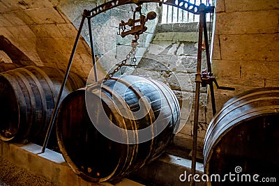 Barrels in a rustic wine cellar Stock Photo