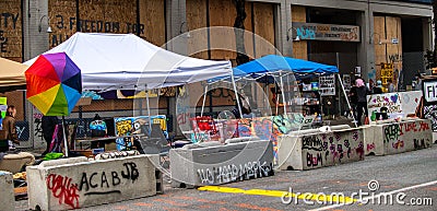Barricades and tents next to the East Precinct in Seattle June 2020 Editorial Stock Photo