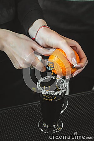 Bartender is making cocktail at bar counter at night club Stock Photo