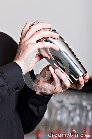 Bartender with steel shaker Stock Photo