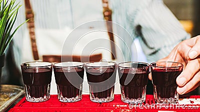 Bartender at work. The barman filled a strong alcoholic drink Stock Photo