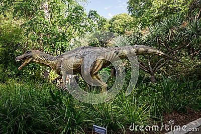 Baryonyx in tall grass display model in Perth Zoo Editorial Stock Photo