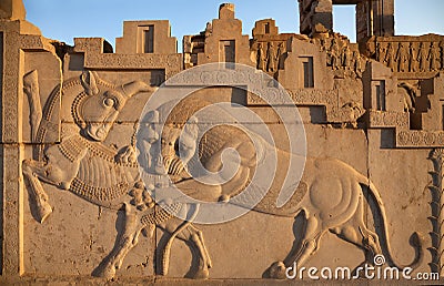 Bas Relief Carving of a Lion Hunting a Bull in Persepolis of Shiraz Stock Photo