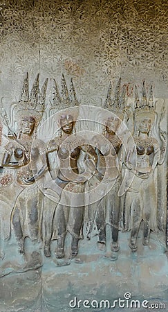 Bas-relief of dancing apsaras in Angkor Wat temple Stock Photo