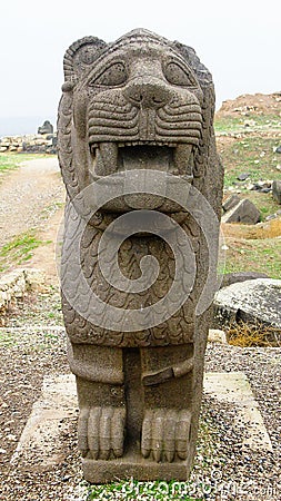 Basalt lion statue, Ruins of Ain Dara temple near Aleppo, Syria Stock Photo