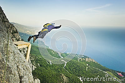 Base-jumper jumps from the cliff Editorial Stock Photo