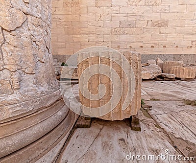 The base and a piece of ancient Greek doric style column at the entrance of Acropolis. Stock Photo