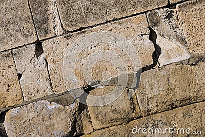 Base stone oblique large rectangular cobblestone close-up light gray background design wall fort Stock Photo