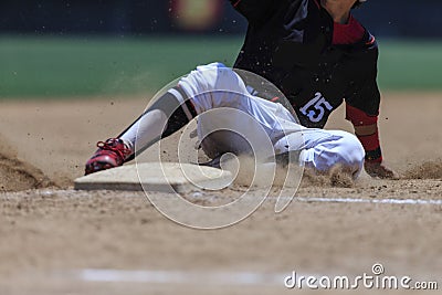 Baseball Action Image - Feet first slide into base Editorial Stock Photo