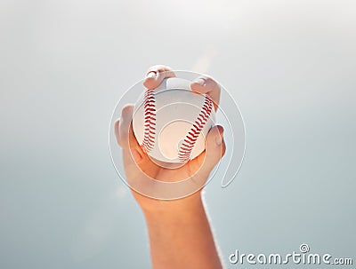 Baseball, athlete hands and ball sports while showing grip of pitcher against a clear blue sky. Exercise, game and Stock Photo