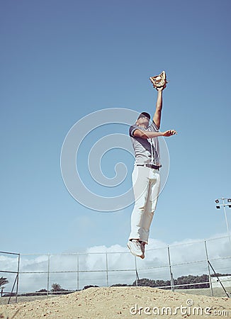 Baseball, athlete jump and sports game, man and fitness on baseball field with exercise, play and pitch outdoor Stock Photo