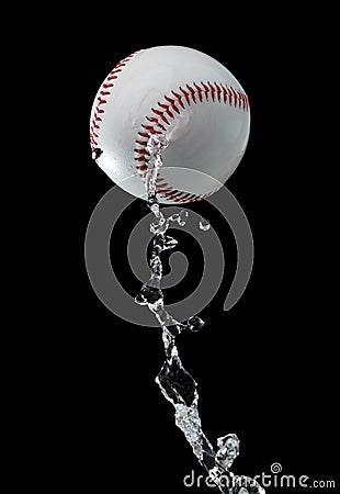 Baseball ball hit water and splash in air. Baseball ball fly in rain and splatter splash in droplet water. Black background Stock Photo