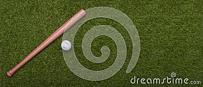 Baseball bat and ball on green grass field. Sport theme background with copy space for text and advertisment Stock Photo