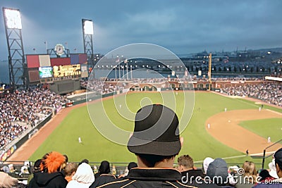 Baseball fan watching night game in San Francisco. Editorial Stock Photo