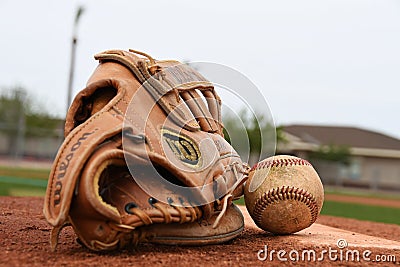 Baseball Glove and Baseball On A Pitching Mound. Editorial Stock Photo