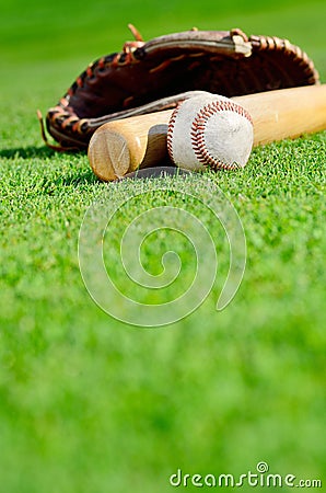 Baseball with glove and bat Stock Photo