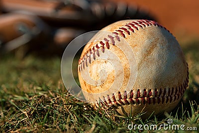 Baseball and Glove on Field Stock Photo