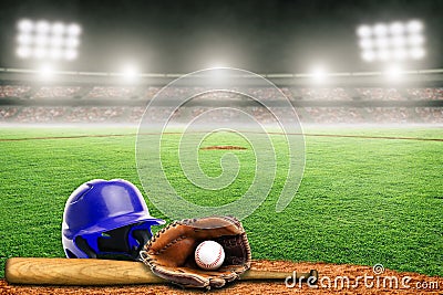 Baseball Helmet, Bat, Glove and Ball on Field in Outdoor Stadium With Copy Space Stock Photo