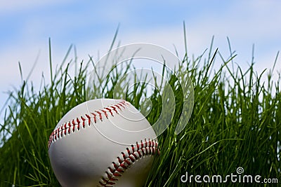 Baseball over young grass background Stock Photo