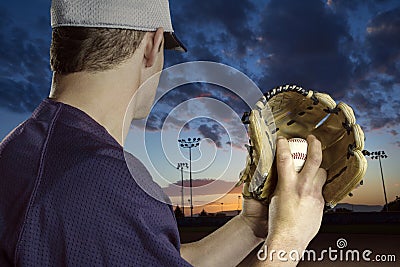 Baseball pitcher ready to pitch in an evening baseball game Stock Photo