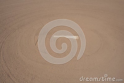 Baseball pitchers` white standing slate bond mound with clay and freshly raked Stock Photo