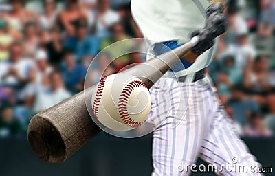 Baseball player hitting ball with bat in close up Stock Photo