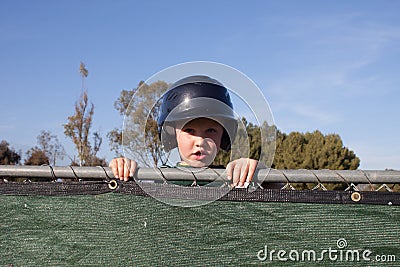 Baseball Player Peeking Over the Dug Out Stock Photo