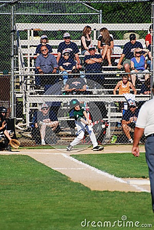 Baseball player swinging at ball Editorial Stock Photo