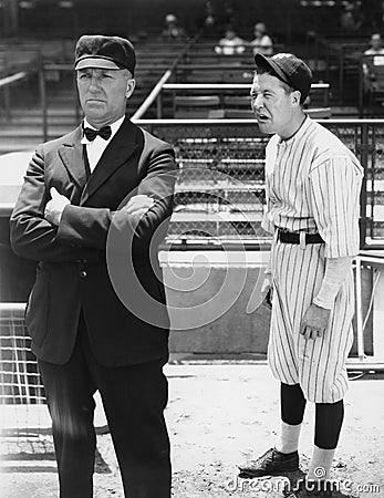 Baseball player and umpire Stock Photo