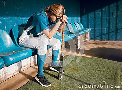 Baseball, sports bench and woman athlete angry thinking of game loss while waiting to play. Frustrated, sad and serious Stock Photo