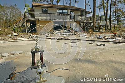 Baseball trophy and debris in front of house heavily hit by Hurricane Ivan in Pensacola Florida Editorial Stock Photo