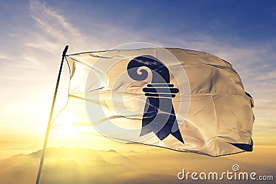 Basel canton of Switzerland flag textile cloth fabric waving on the top sunrise mist fog Stock Photo