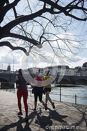 group of people running in the street in border rhine river Editorial Stock Photo