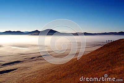 Bashang grassland in autumn, morning mist Stock Photo