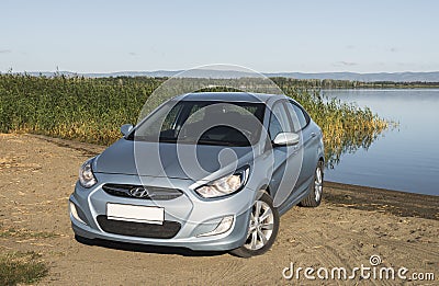 Bashkortostan, Russia - August 3, 2015: The car is a Hyundai Accent on the lake. Editorial Stock Photo