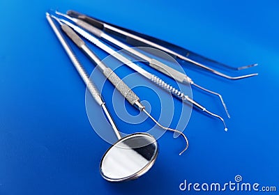 Basic dental instrument with blue background Stock Photo