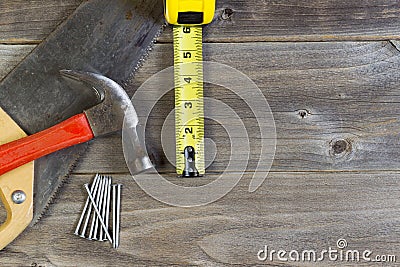 Basic home repair tools on weathered wood Stock Photo