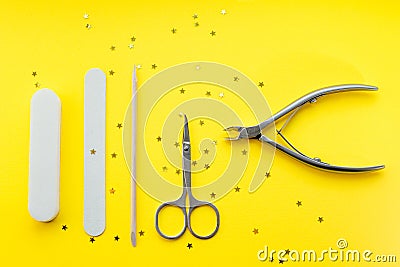 Basic set of nail accessories for being a star on a yellow background Stock Photo