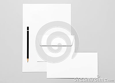 Basic stationery: sheet of paper, two envelopes and pencil Stock Photo