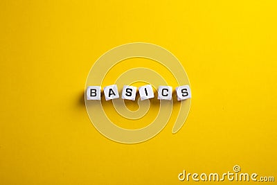 Basics word written on blocks with flat lay view. Back to basics or simplifying business concept Stock Photo
