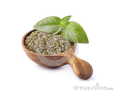 Basil fresh and dry in wooden spoon on a white background. Spice isolated Stock Photo