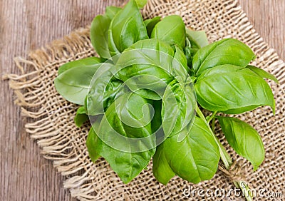 Basil on wooden background Stock Photo